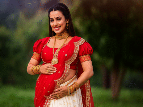 Pregnant Indian woman in saree during maternity photoshoot